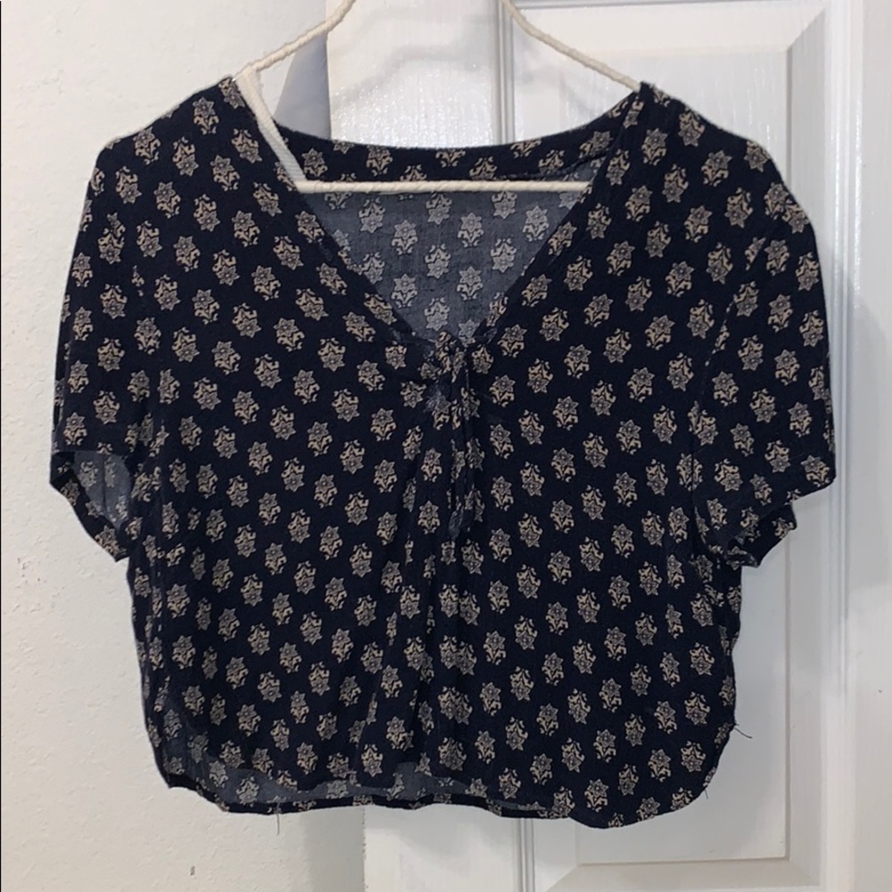 a cropped flower shirt with a tie!